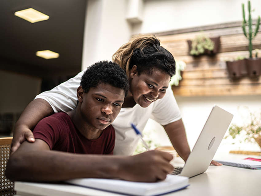 little girl holds adoptive mother's hand