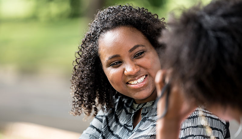 young african american adopted adult talks with a counselor about locating her international birth family