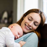 Young, white Host Mother cares for infant baby